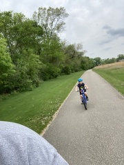 Little Man Following on the Bike